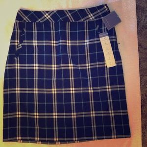 Plaid skirt knee length.